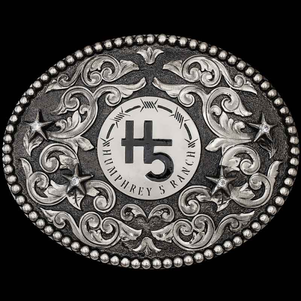 "The Bishop Custom Buckle is crafted on a oval, German Silver base with a matted finish. Detailed with a beaded edge, German Silver scrolls and stars! 

Customize it with your lettering, figure and stones below. Your belt buckle comes with a beauti